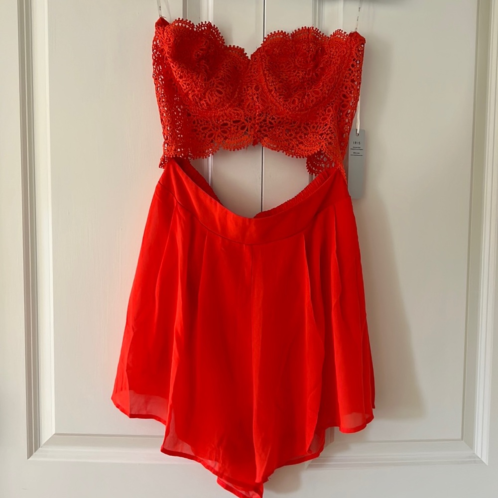 NWT. Orange Lacy Romper with Cutout. Size M.